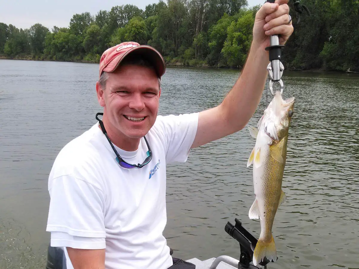 Scott holding up a walleye for a closeup photo